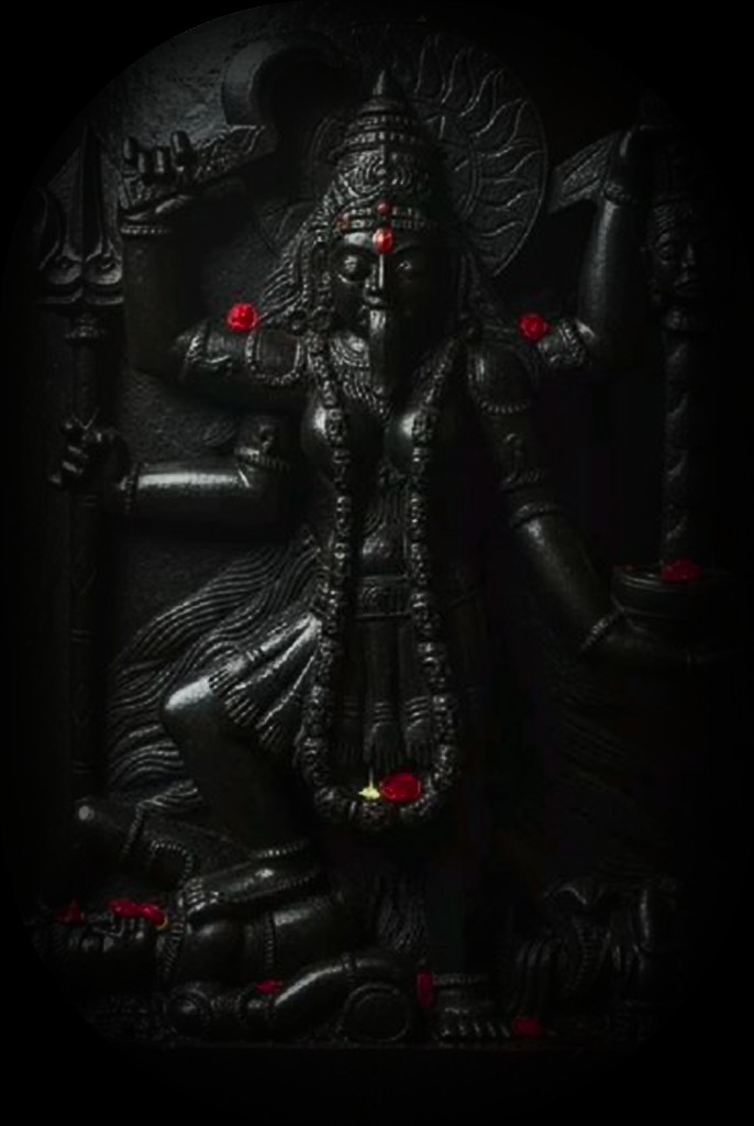 Maa Adya Kali, Stone carved murti with rose petals